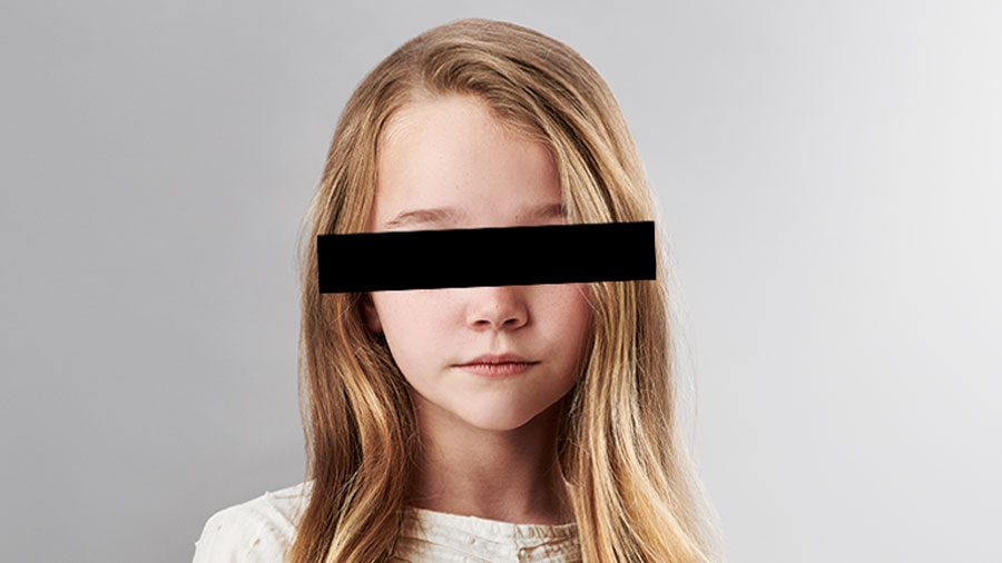 young girl with black bar over eyes