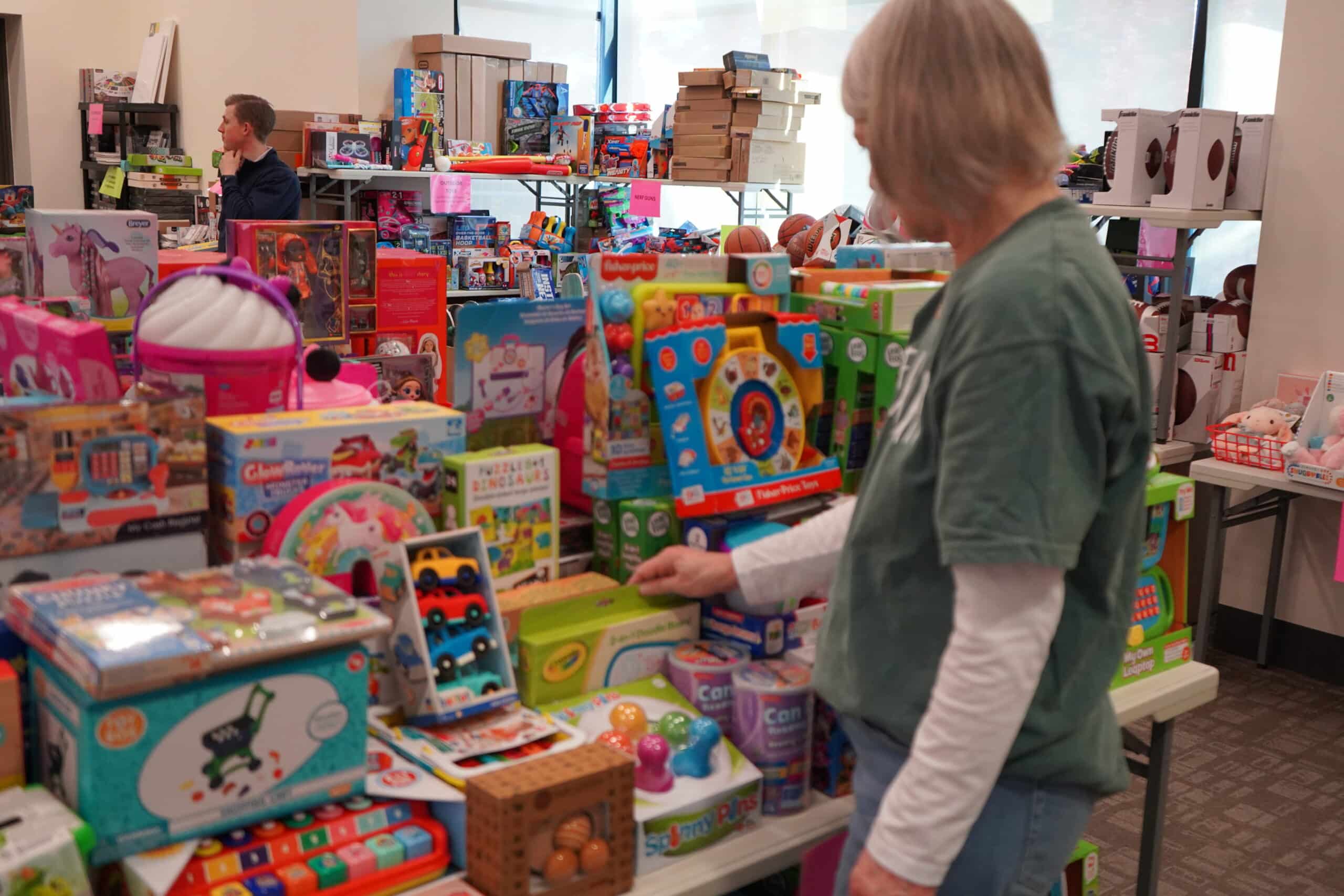 Woman at kids toy store looking for a gift